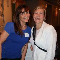 women pose for picture